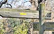 Hiking signposts on the trail passing