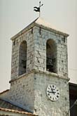 The stone bell tower in Andon village, photo