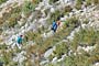 Hikers moving up the hill towards Crete de la Madone 