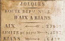 Ancient road sign at Joques, Aix