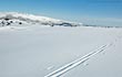 Cross-country ski tracks acros a snowy Calern Plateau.