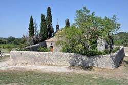 A stone wall and hermitage on