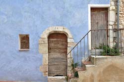 Blue facade, steps, along Cours National
