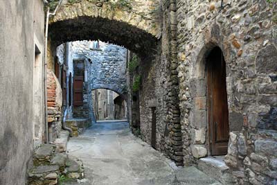 Ancient stone walls along a narrow