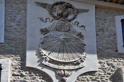 Large stone sundial with eagle, in