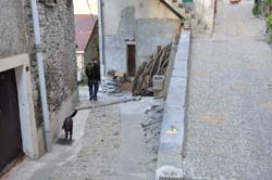 Hiker going down through Venanson village
